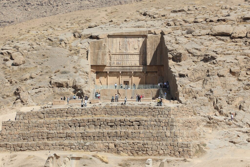The rock-cut tomb of Artaxerxes III above the terrace.