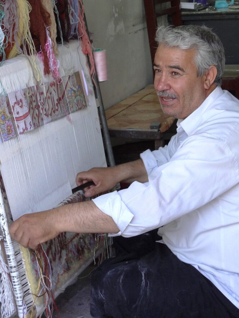 A carpet weaver at work in Miyandoab.