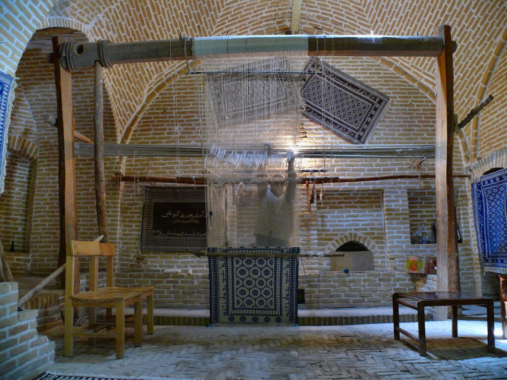 Weaving a carpet at the Meybod caravanserai.
