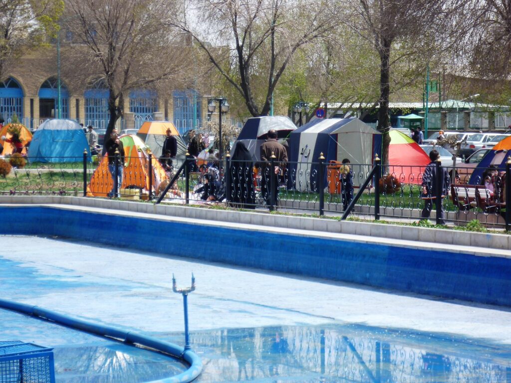 Families outdoors on Sizdah Bedar in Tabriz.